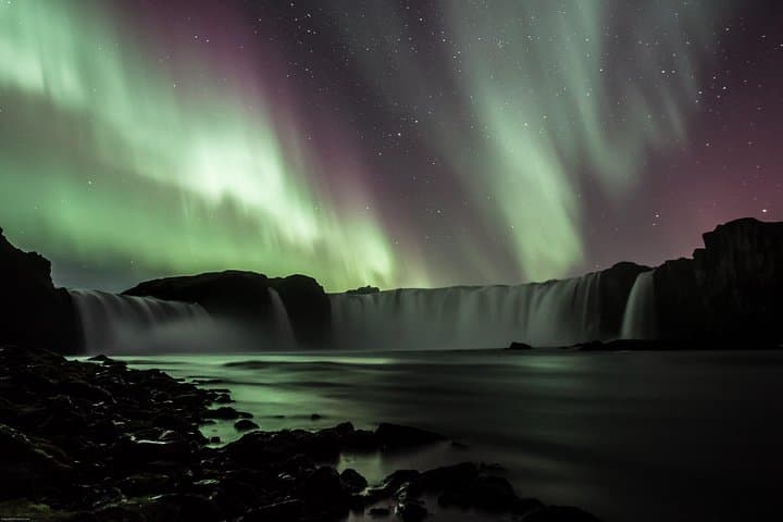 Northern lights over waterfalls of gods Godafoss