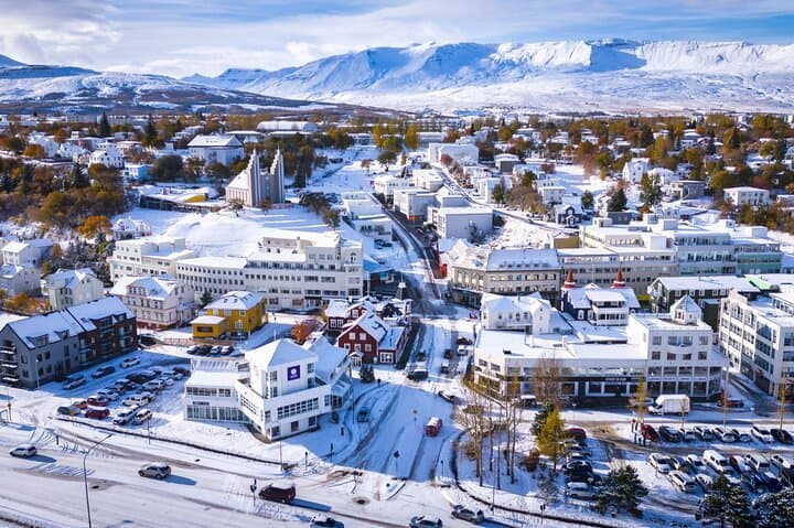 Snow-covered streets glow softly during North Iceland’s winter days