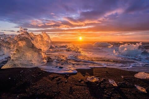 During sunset Jokulsarlon transforms into a mesmerising show of the sun reflecting on the ice