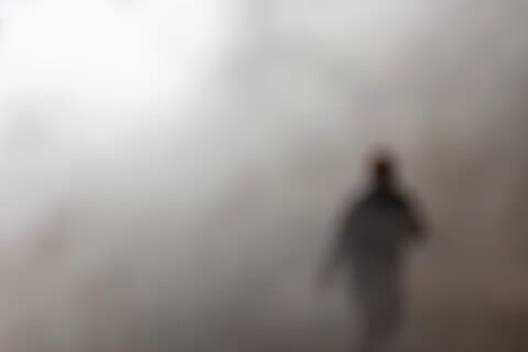 A ghostly figure emerges through the mist, spooky!