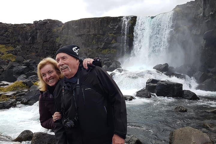 Posing at the waterfall Öxarárfoss at the National Park