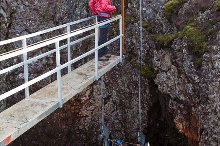 Descend inside a volcano's crater in an open elevator