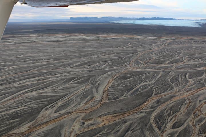 Airplane tour over black sands and riverbeds from Skaftafell