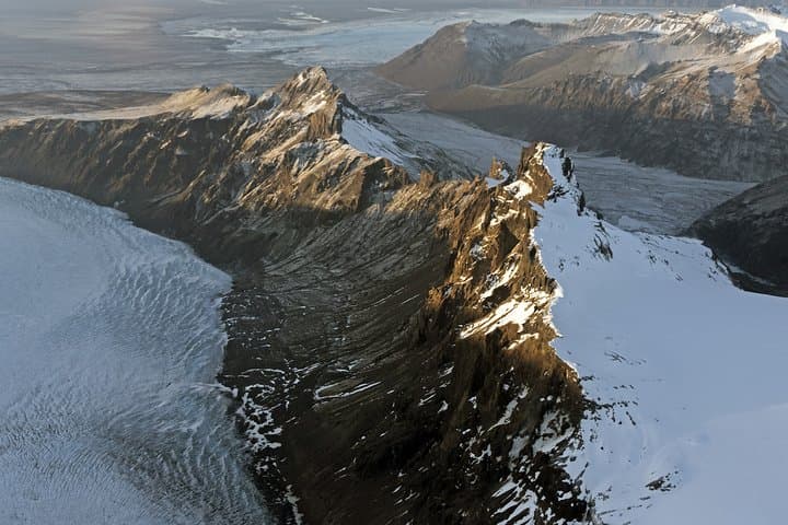 Airplane flight over glacier lagoons and Iceland's highest peak