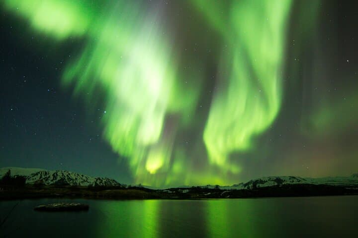 Dancing lights over Iceland! Experience the magic of the Northern Lights as they paint the Arctic sky in shades of green — a breathtaking natural wonder you’ll never forget.