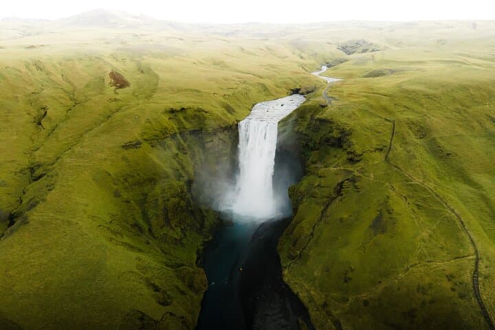 Behold the power of nature as you listen to water crashing into the basin at Skogarfoss