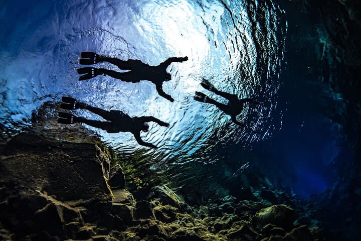 Breathtaking view of snorkelers on the surface of Silfra