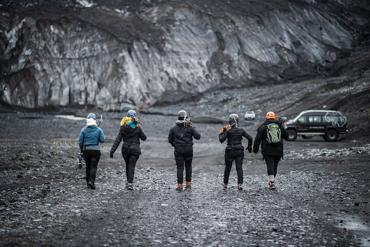 A group of travelers sets off on a glacier hike at Solheimajokull Glacier.