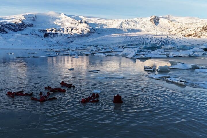 Floating at Fjallsárlón glacier lagoon with the glacier view.